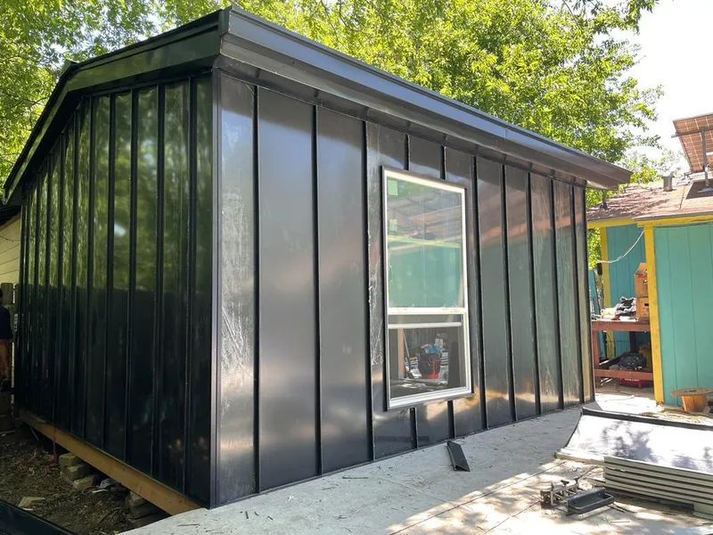 Black standing seam metal wall panels for Roof Inspection in Richland